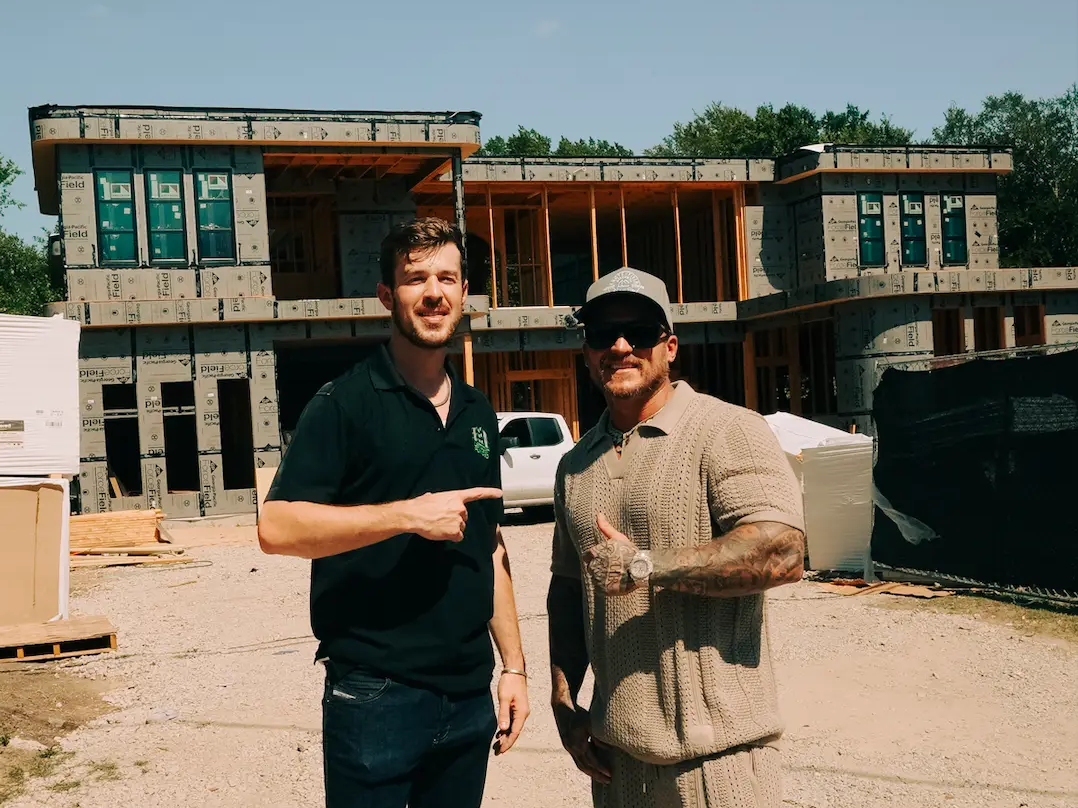 Evan Rugen and Eric Crutchfield at a construction site